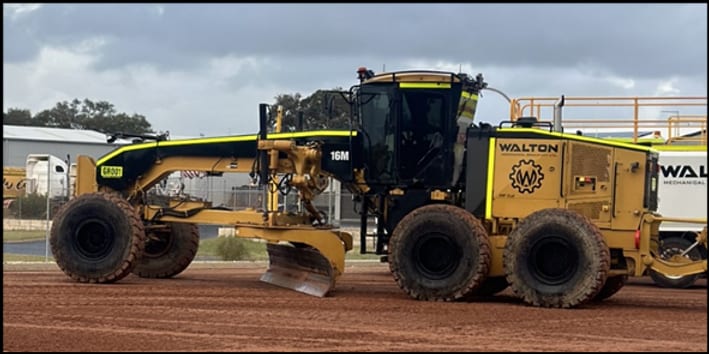 Walton Mechanical CAT 16M motor grader side view